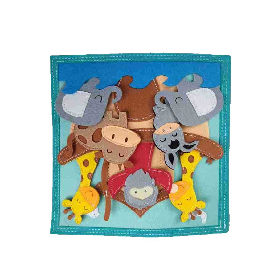 Activity Books felt cloth page in teal with colorful layered animal faces, including elephants, giraffes, a cow, and a lion.
