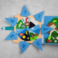 Children’s felt Activity Books page in blue and peach, with a rotating numbered wheel and colorful animal and nature appliqués.