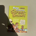 Children Educational Story Books, a yellow-green paper-cover book titled “Raise Children Street-Smart,” with colorful cartoon children and a boat illustration.