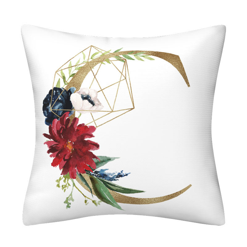 Pillowcase with white polyester fabric, red and navy flowers, gold geometric lettering and green leaves in an English Alphabet design.