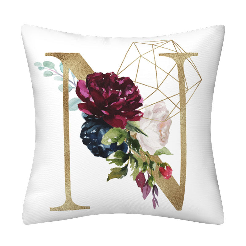 Pillowcase in white polyester with a large gold English Alphabet letter, burgundy floral print and geometric line accents.