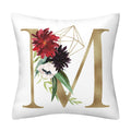 Pillowcase in white polyester with a gold English Alphabet M, red and purple flowers, green leaves and geometric line art.