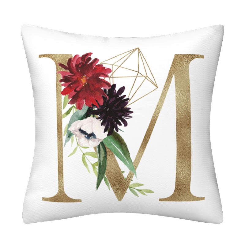 Pillowcase in white polyester with a gold English Alphabet M, red and purple flowers, green leaves and geometric line art.