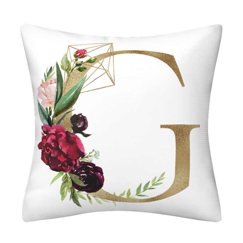 Pillowcase in white polyester featuring a large gold English Alphabet letter G, floral cluster and geometric accents.