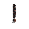 African Box Braids synthetic hair extension in a thick black and dark brown braid with a loose two-tone tassel end