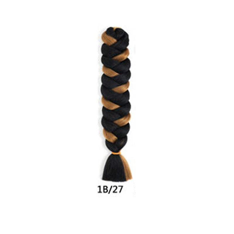 African Box Braids synthetic hair extension in a thick black and caramel-brown braid with a loose tapered end