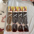African Box Braids in long, tightly braided synthetic hair, shown in four sealed packs of brown and black shades