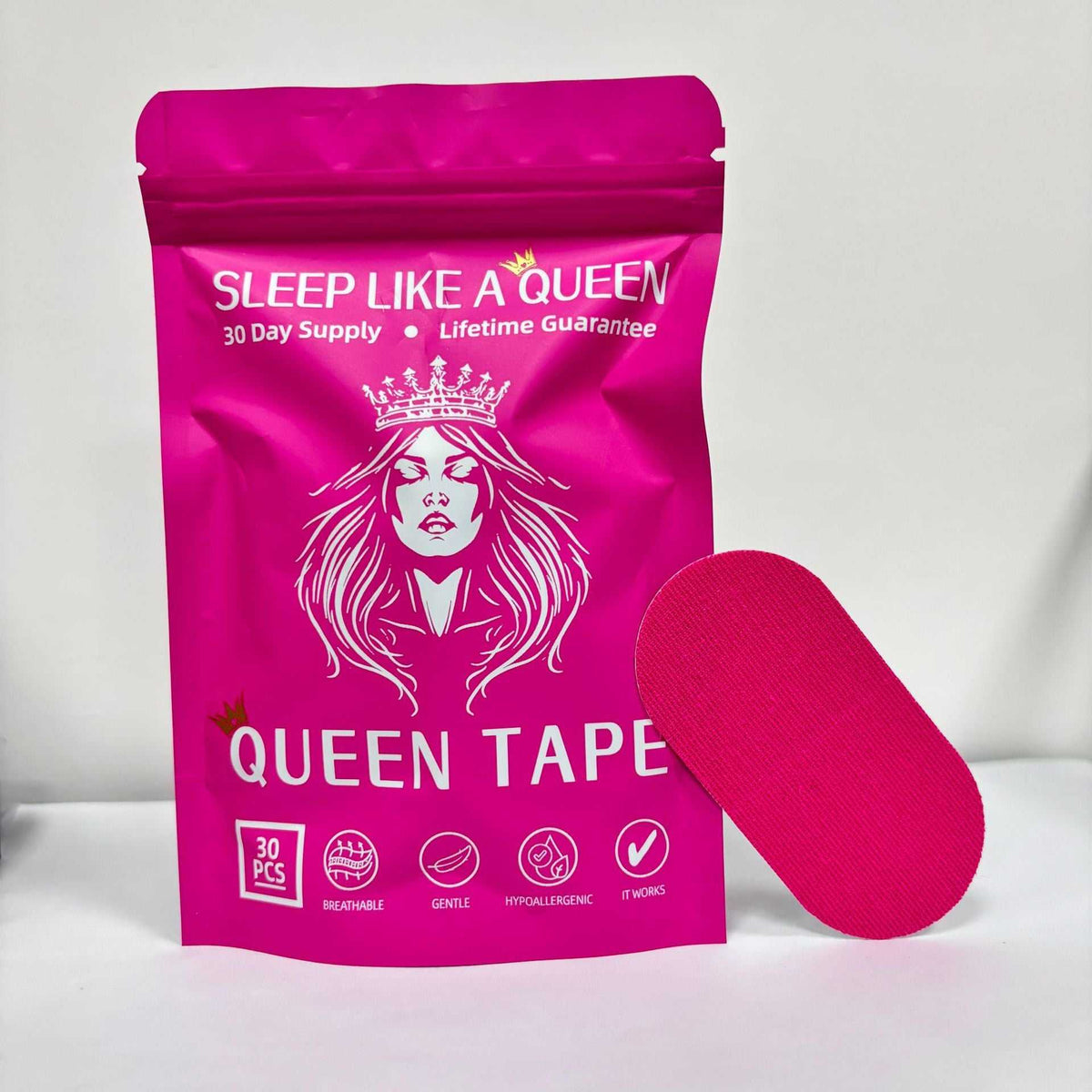 Anti Snoring Mouth Tape in bright pink cotton with a smooth oval strip beside matching queen-themed resealable packaging