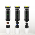 Automatic Capsule Espresso maker in black with yellow-rimmed top, green digital display and modular brewing parts