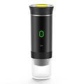 Automatic Capsule Espresso maker in black plastic with a cylindrical body, green-lit button, yellow top detail, and clear ribbed base