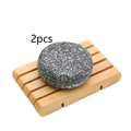 Bamboo Charcoal Shampoo Soap Bar in dark gray with a speckled texture, shown as a two-piece set on a wooden soap dish.