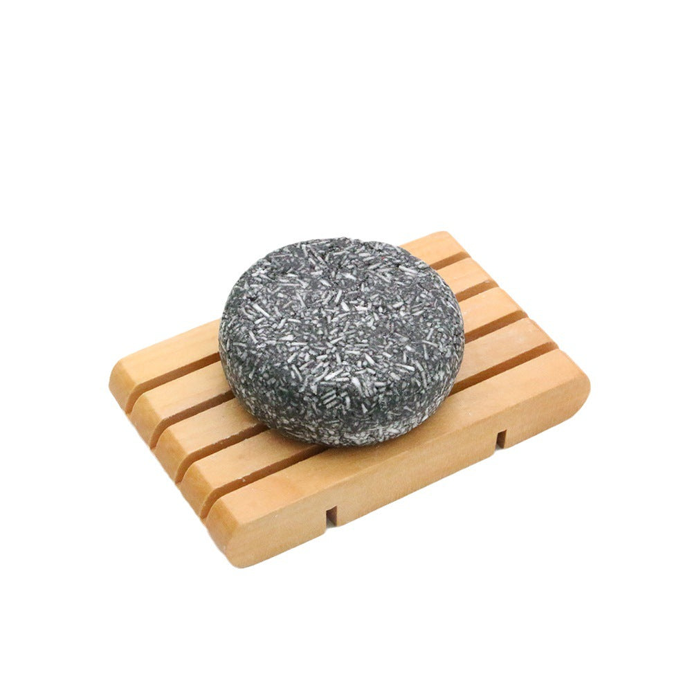 Bamboo Charcoal Shampoo Soap Bar, dark gray with a speckled charcoal texture and rounded handmade shape