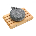 Bamboo Charcoal Shampoo Soap Bar, round charcoal gray solid bar with a mottled texture and pale flecks