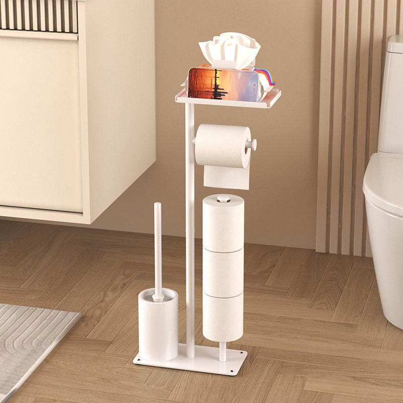 Bathroom Floor-Standing Tissue Holder in white metal with a flat base, toilet roll arm, brush holder, and top shelf.
