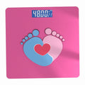Bluetooth Rechargeable Body Fat Scale in glossy pink with a digital display and blue and pink footprints surrounding a red heart