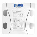 Bluetooth Rechargeable Body Fat Scale with a white tempered-glass surface, four dark metallic sensor pads, and a blue digital display