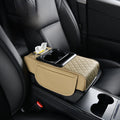 Car-mounted tissue box in beige leather with diamond quilting, a tissue opening, cup holders, and a storage pocket