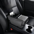 Car-mounted tissue box in black leather with diamond-quilted padding, a tissue slot and dual cup holders