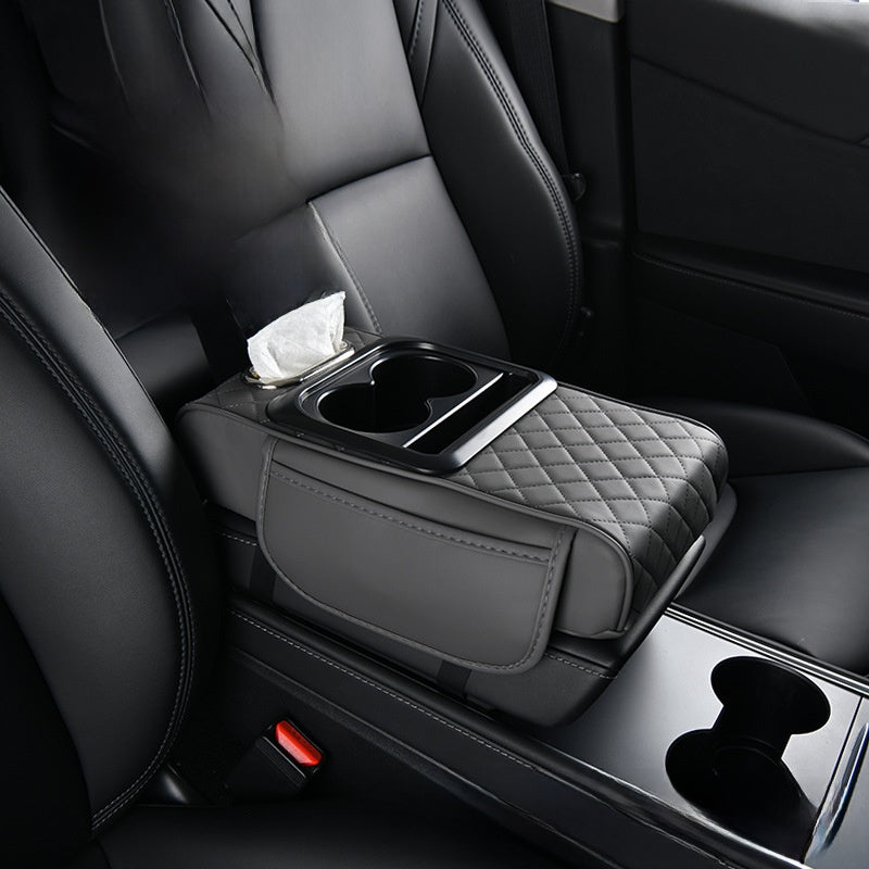 Car-mounted tissue box in black leather with diamond-quilted padding, a tissue slot and dual cup holders