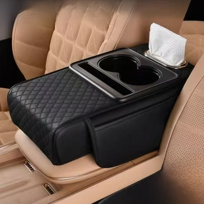Car-mounted tissue box in black quilted leather with red piping, a tissue slot, cup holder and side storage bag.