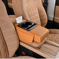 Car-mounted tissue box in orange leather with quilted stitching, a tissue compartment and dual cup holders