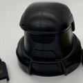 Car Window Ice electric scraper in black ABS plastic, with a rounded cordless housing and broad scraping base
