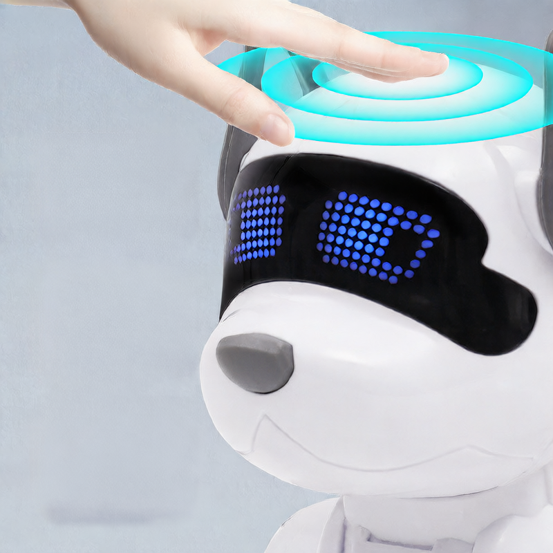Children's remote-controlled robot dog in white plastic with blue accents, floppy ears and a glowing blue LED face display.
