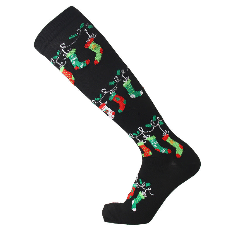 Christmas Compression Socks in black knit fabric with colorful red and green hanging Christmas stocking patterns