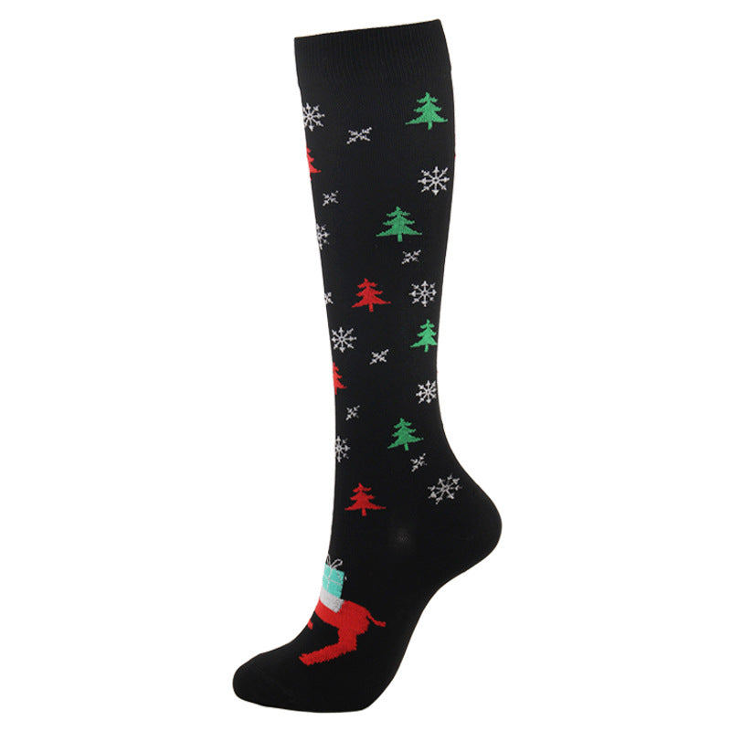 Christmas Compression Socks in black with red and green Christmas trees, white snowflakes and a festive reindeer motif