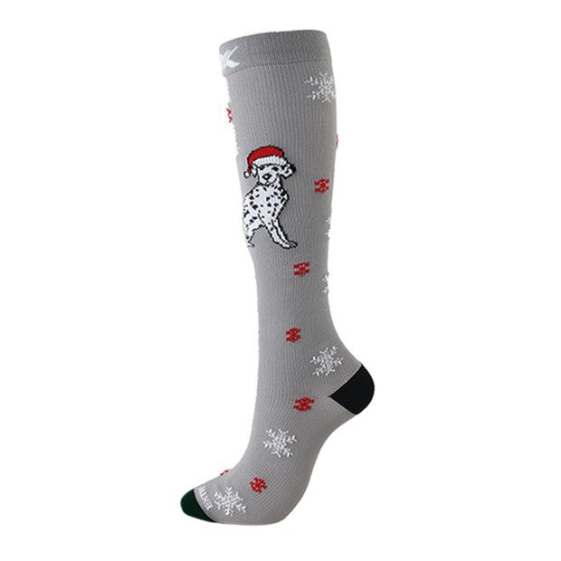Christmas Compression Socks in gray knit fabric feature a Santa-hat dog, red snowflakes, white motifs, and dark heel and toe