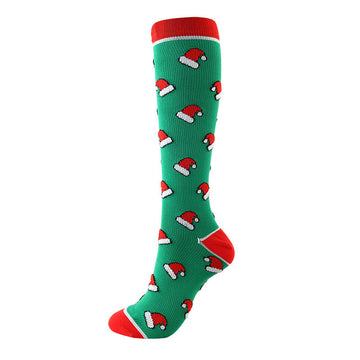 Christmas Compression Socks in bright green knit with repeating Santa hat motifs and red cuffs, heel and toe panels.