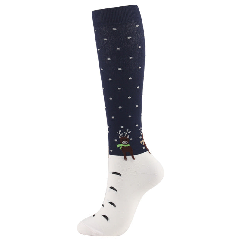 Christmas Compression Socks with navy and white sections, tiny scattered snowflakes, a reindeer motif and black grip marks