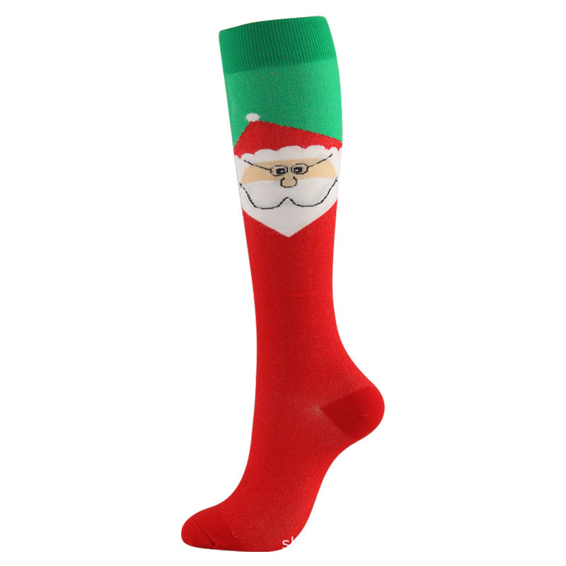 Christmas Compression Socks in red and green knit fabric, featuring a white Santa face design across the calf