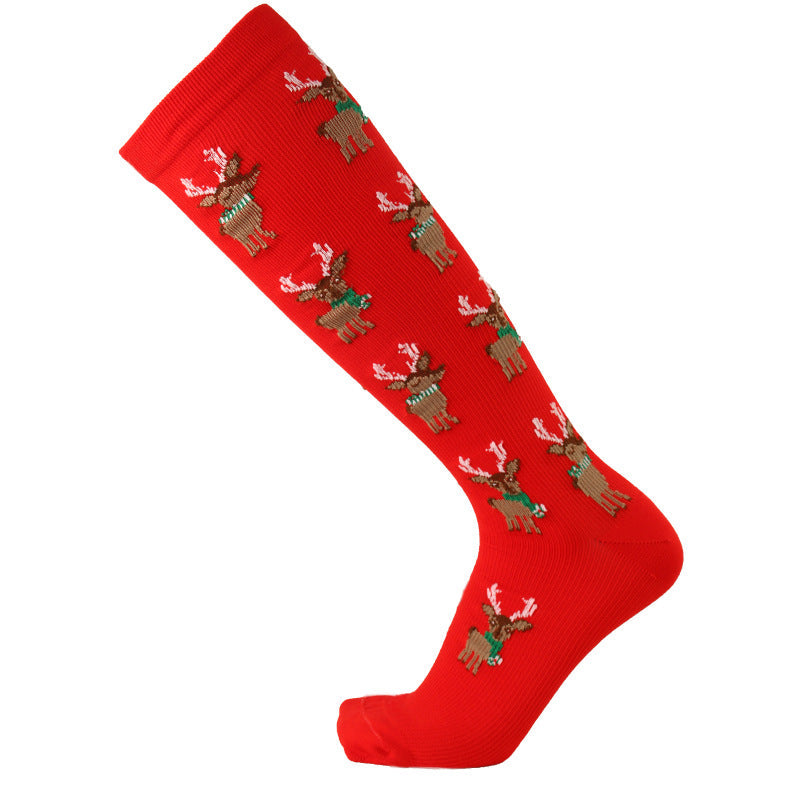 Christmas Compression Socks in bright red knit fabric, patterned with small brown reindeer and white festive accents