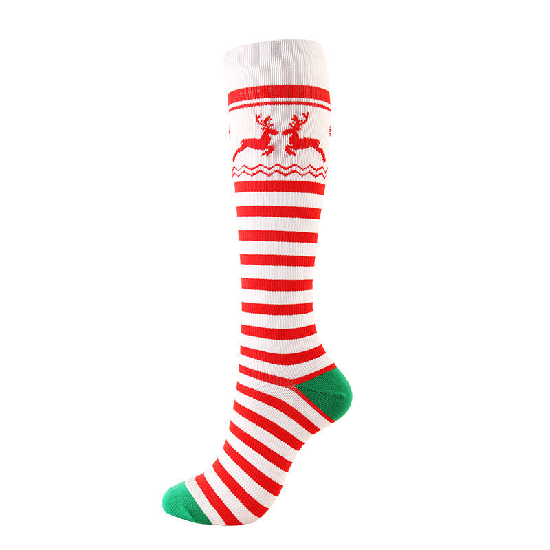 Christmas Compression Socks in white knit with red stripes, reindeer and zigzag motifs, plus green toe and heel accents