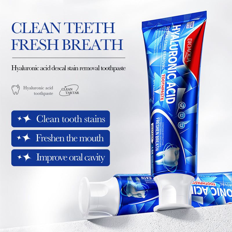 Clean Teeth Toothpaste tubes in glossy blue and red packaging, featuring bold hyaluronic acid lettering and a flip-top cap.