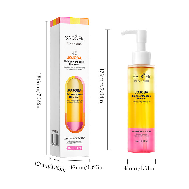 Cleaning face dissolving make-up oil in a clear pump bottle, with bright yellow liquid, pink base and matching rainbow-accented box.