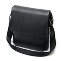 Cowhide Men's Shoulder Bag in black pebbled leather with a broad flap, structured body and adjustable fabric strap