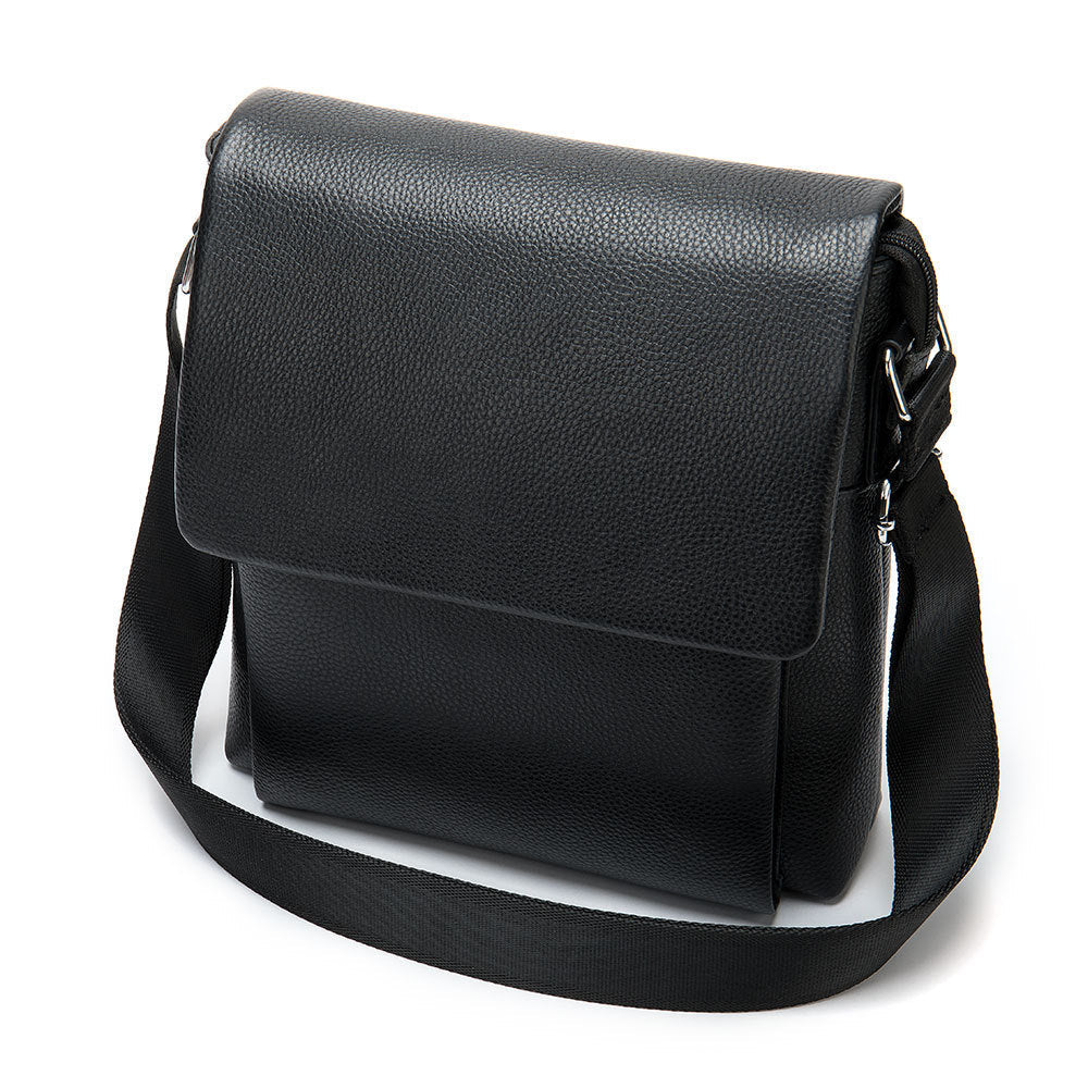 Cowhide Men's Shoulder Bag in black pebbled leather with a broad flap, structured body and adjustable fabric strap