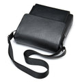 Cowhide Men's Shoulder Bag in black pebbled leather, featuring a smooth flap closure and adjustable fabric strap