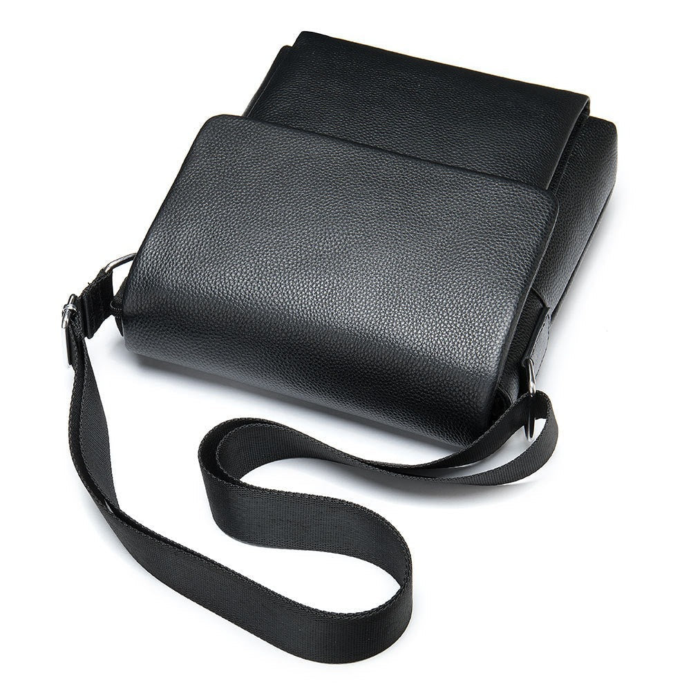 Cowhide Men's Shoulder Bag in black pebbled leather, featuring a smooth flap closure and adjustable fabric strap