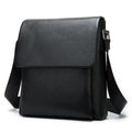 Cowhide Men's Shoulder Bag in black pebbled leather, featuring a clean flap front, stitched edges and adjustable strap.
