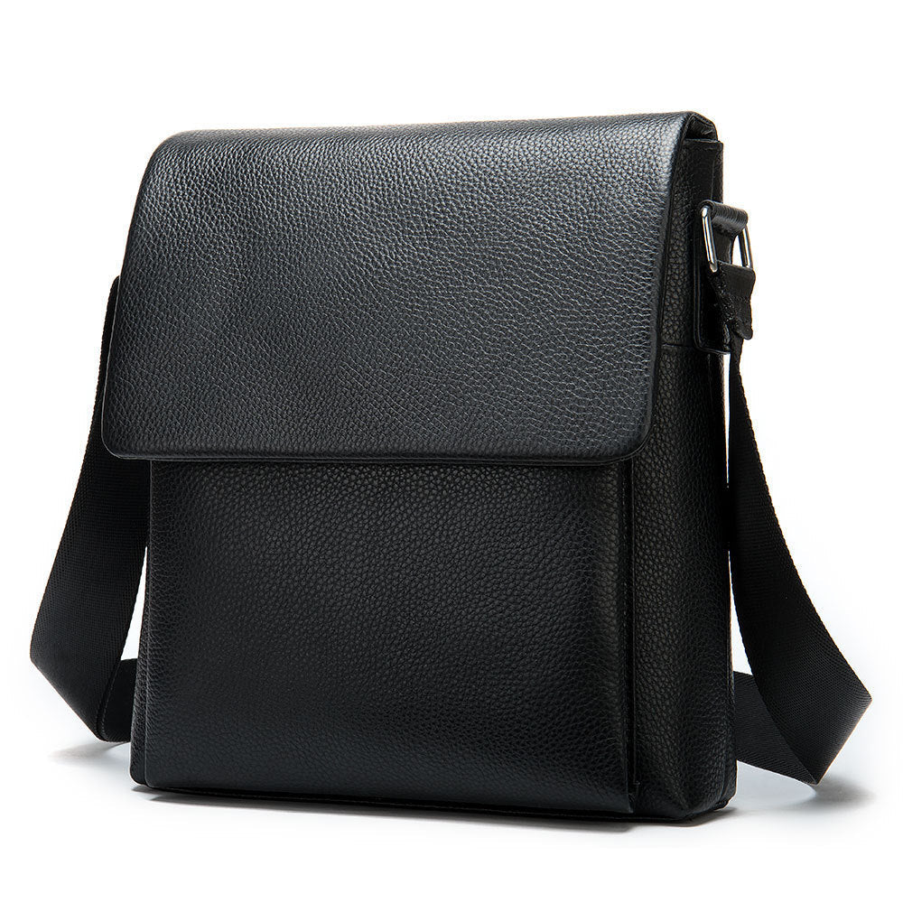 Cowhide Men's Shoulder Bag in black pebbled leather, featuring a clean flap front, stitched edges and adjustable strap.