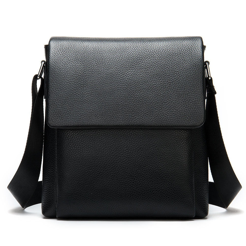 Cowhide Men's Shoulder Bag in black pebbled leather, featuring a structured rectangular shape, flap closure, and wide adjustable strap.