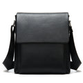 Cowhide Men's Shoulder Bag in black pebbled leather, featuring a structured rectangular shape, flap closure, and wide adjustable strap.