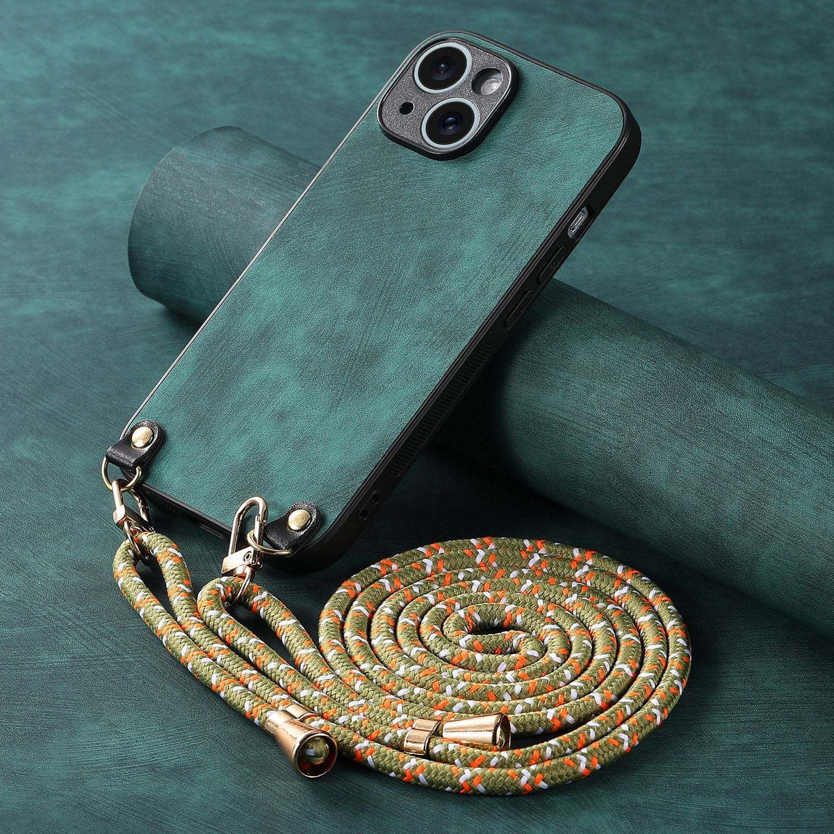 Crossbody Phone Case in teal textured leather with a black-edged phone cover and braided multicolor rope strap