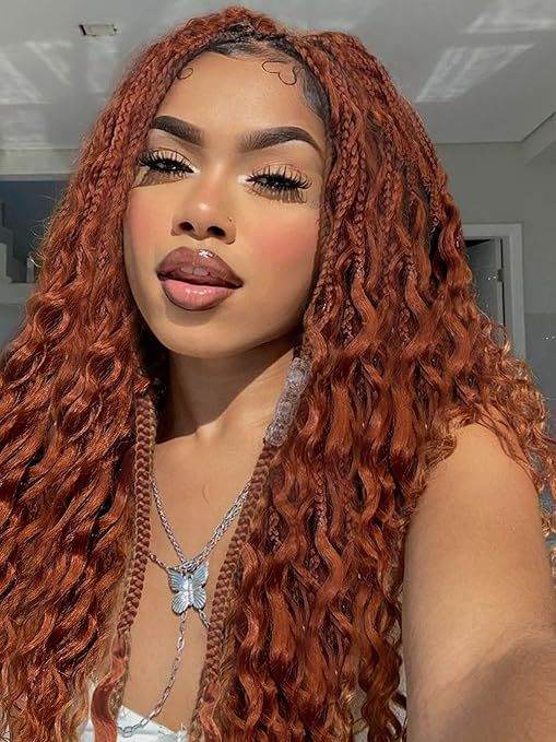 Curly Three-Strand Braids in long copper-red hair, with defined plaits blending into loose, textured curls