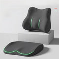 Cushion to prevent buttock pain in black contoured foam, with a matching lumbar support cushion and glowing green trim