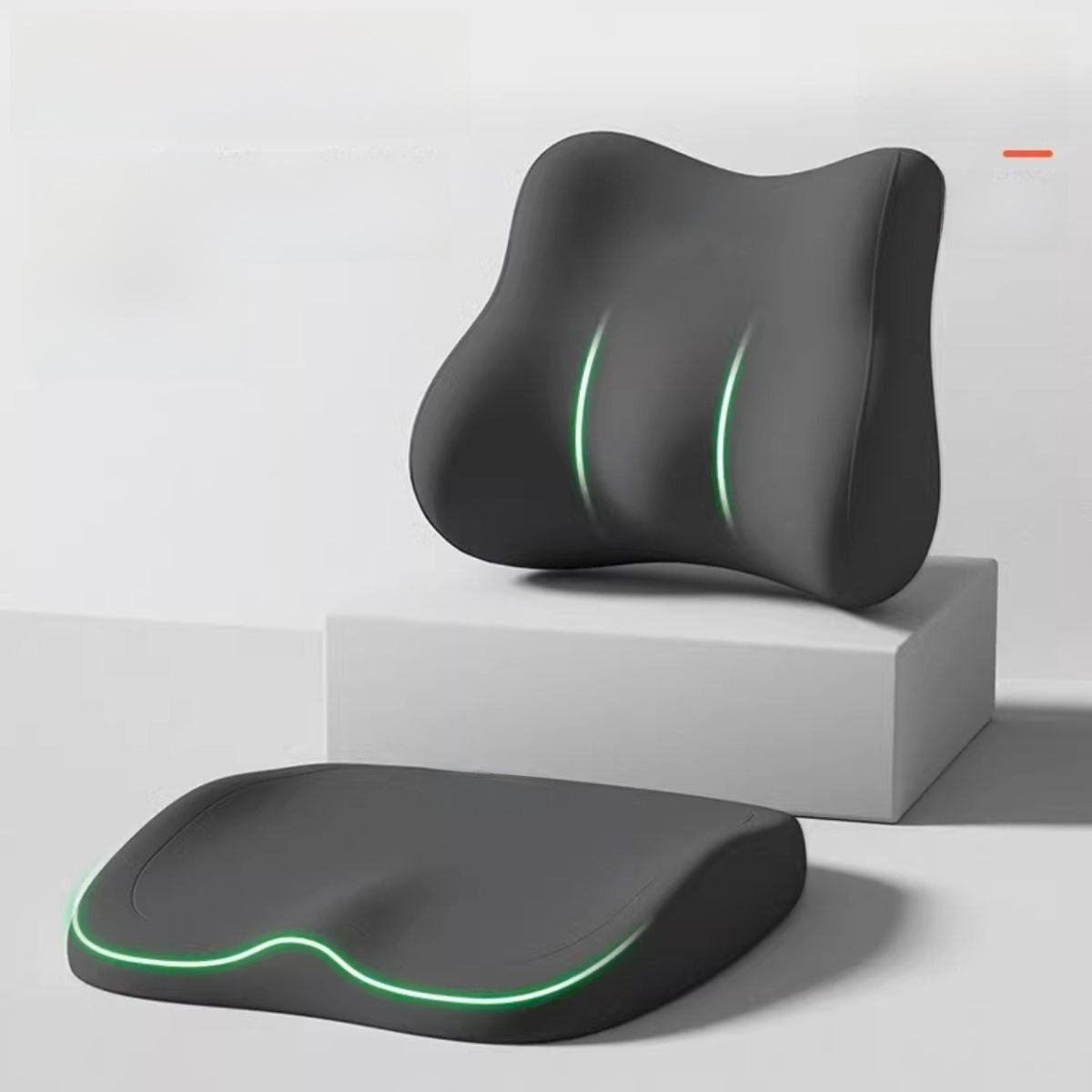 Cushion to prevent buttock pain in black contoured foam, with a matching lumbar support cushion and glowing green trim