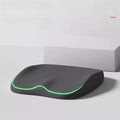 Cushion to prevent buttock pain, black contoured seat cushion with a smooth surface and glowing green edge